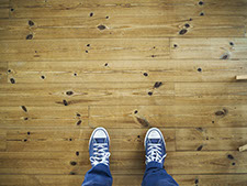 birds eye view of someone standing on a wooden floor